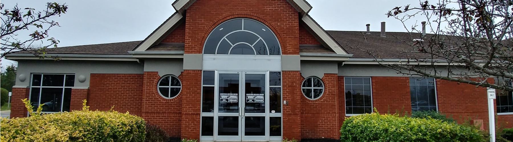 front of two story brick building