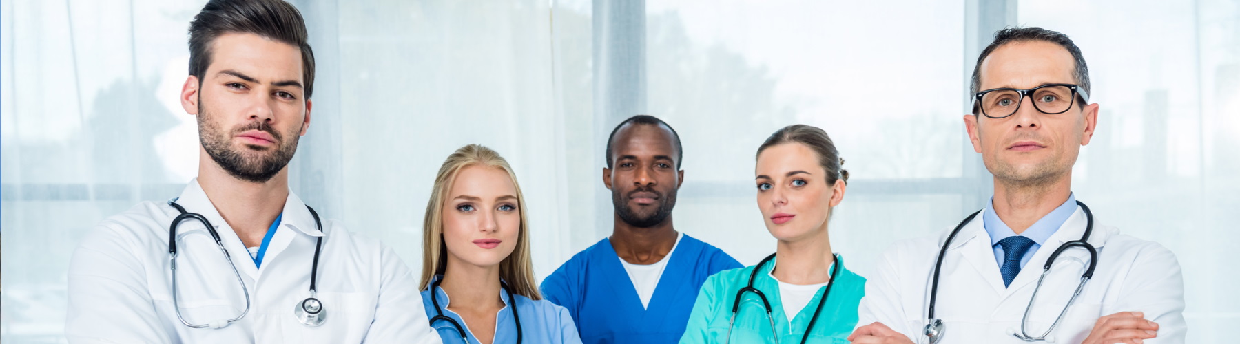 Group of medical professionals with arms crossed